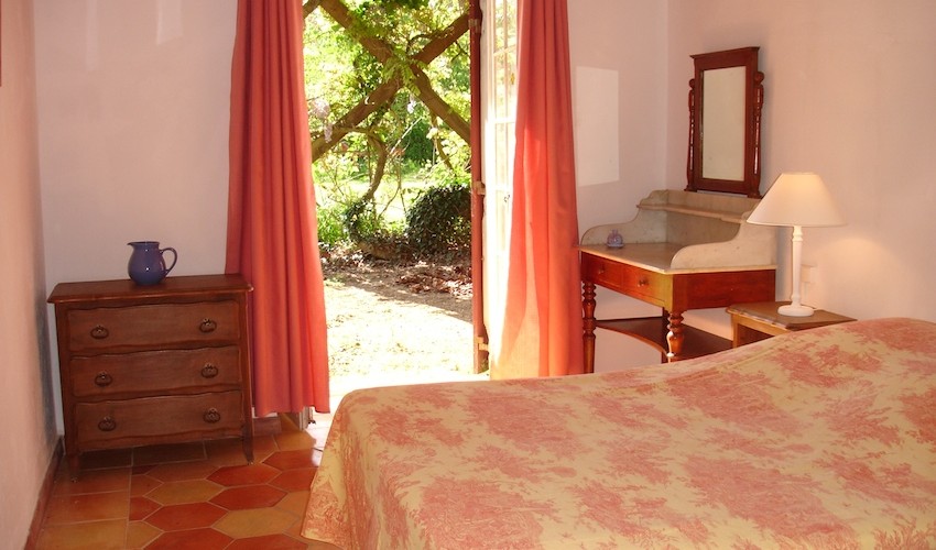 double bedroom with french doors to east terrace and garden